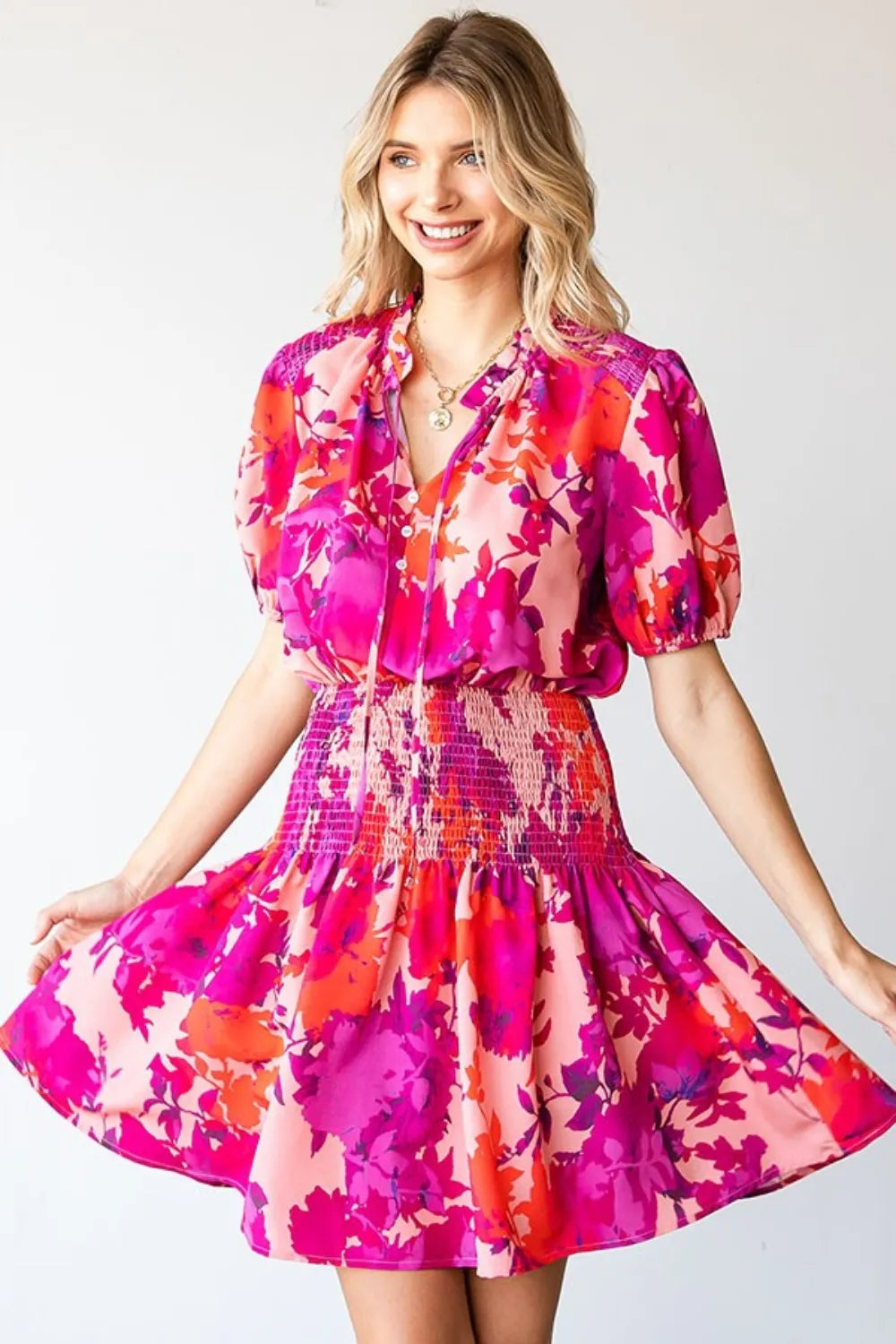 First Love Floral Smocked Mini Dress by Trendsi, short sleeve with a feminine floral print and a flattering smocked bodice.