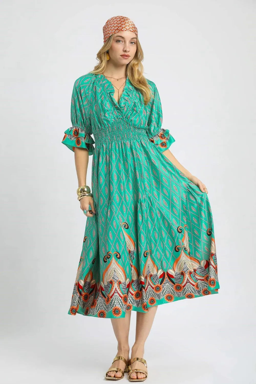 Umgee printed smocked waist midi dress with flounce sleeves, showcased in a stylish fashion image.