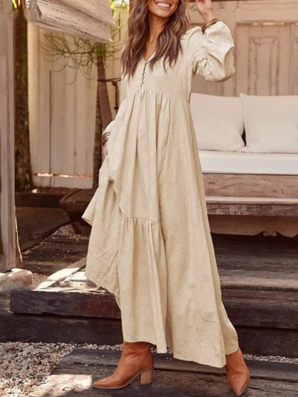 Plus size Trendsi full size V-neck long sleeve tiered maxi dress with pockets, featuring a flowy silhouette and comfortable fit.
