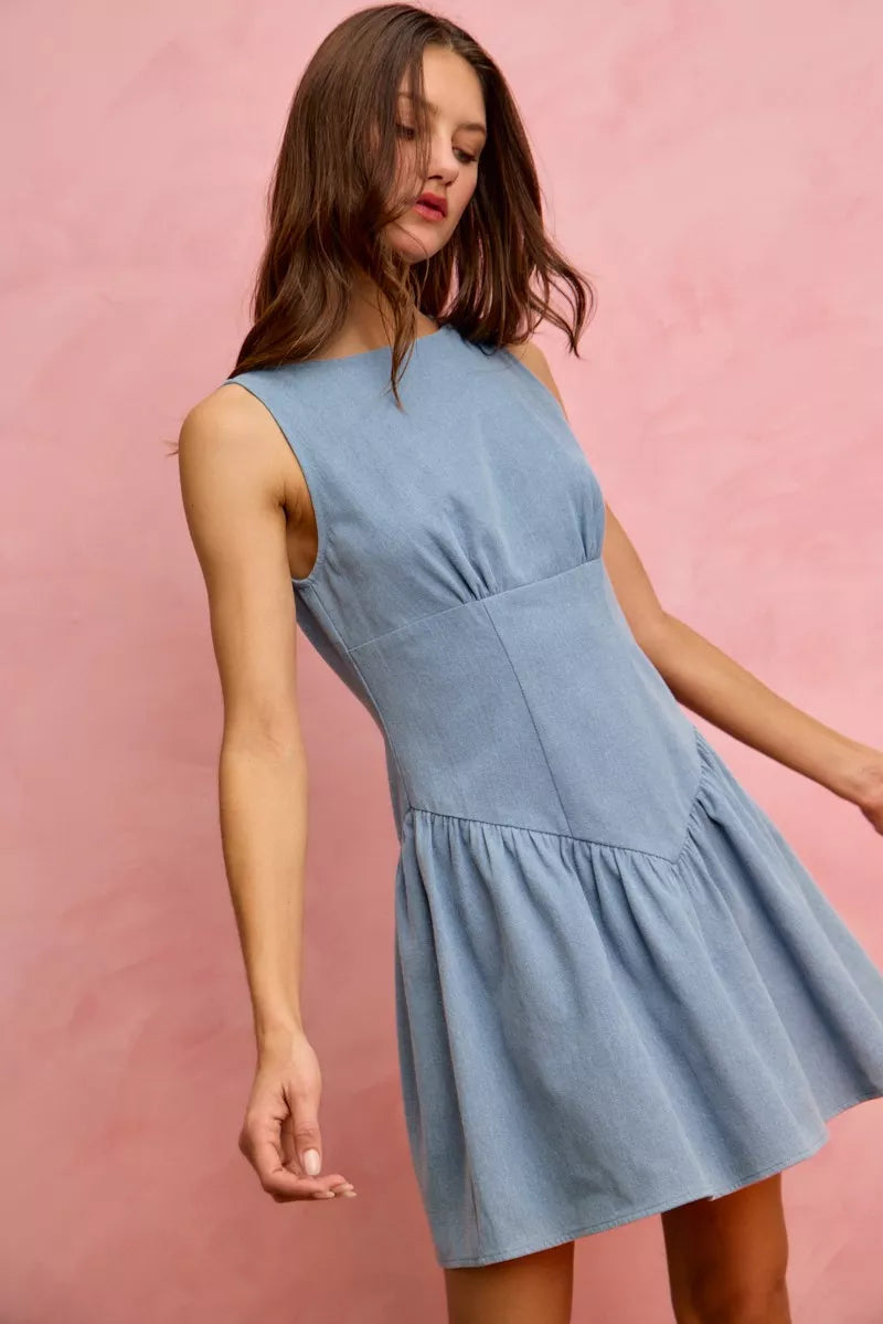 Sleeveless denim mini dress by Trendsi featuring a fit and flare silhouette, perfect for casual and summer wear.