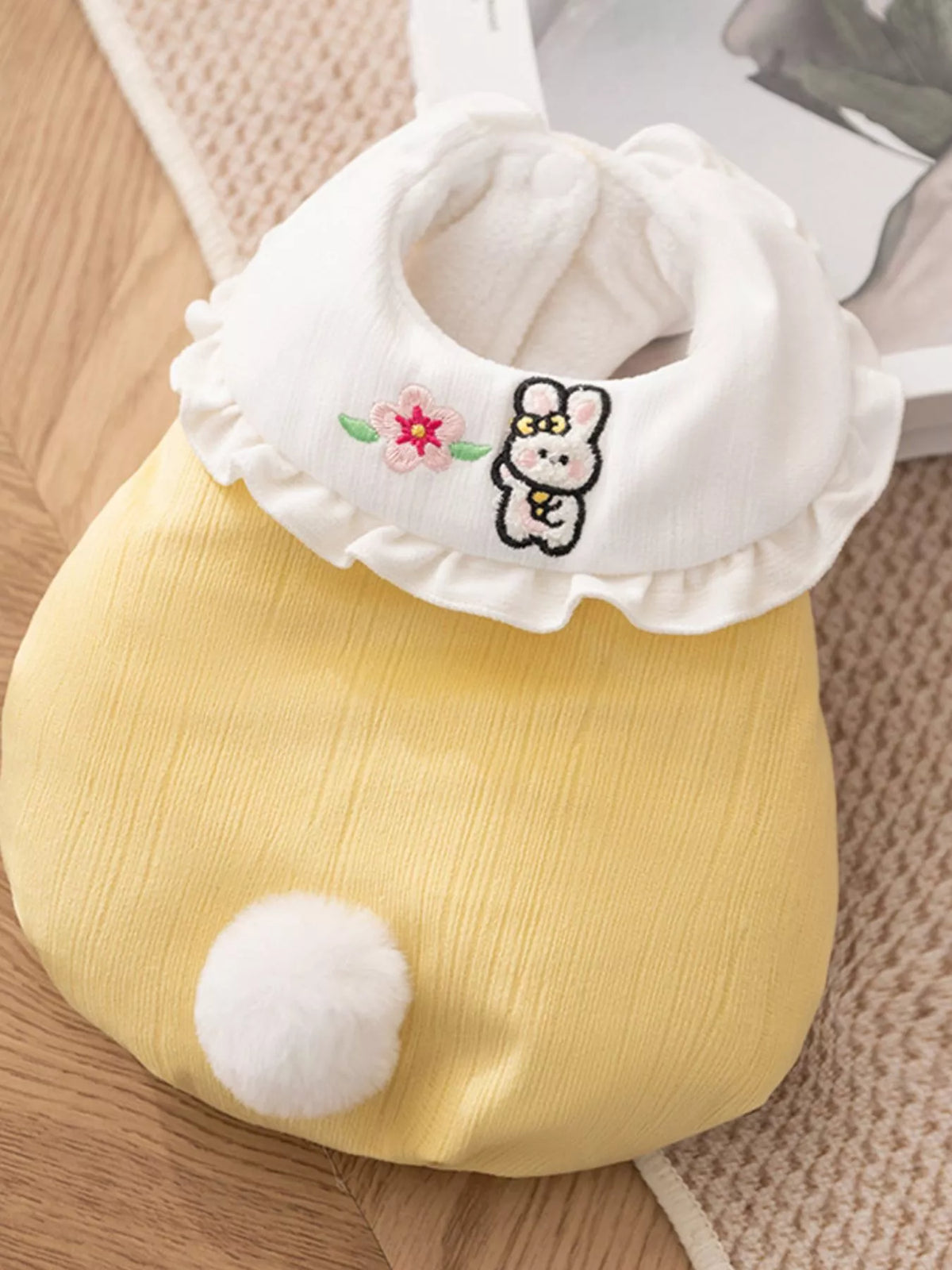 Button-down pet jumpsuit with a ruffle collar, featuring trendy design and comfortable fit for pets.