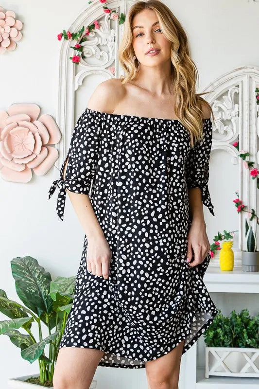 Heimish plus size animal print mini dress with short sleeves and off-shoulder design, styled for a casual look.