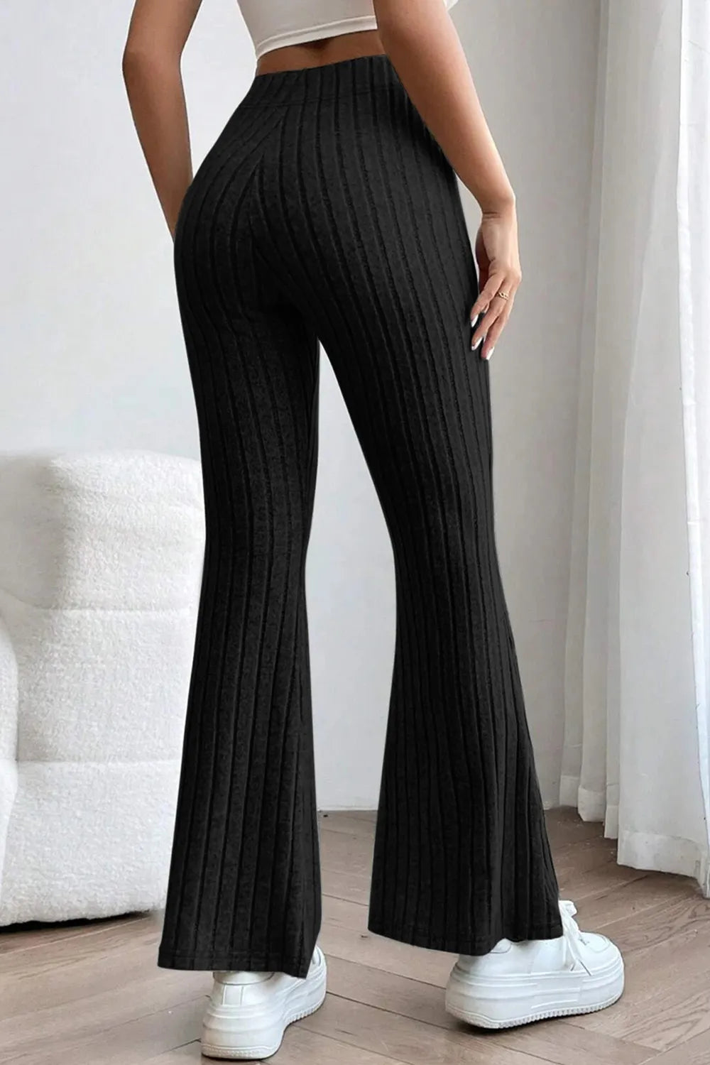 Full size ribbed high waist flare pants by Trendsi, featuring a basic Bae design with a fitted ribbed waistband and flared leg silhouette.