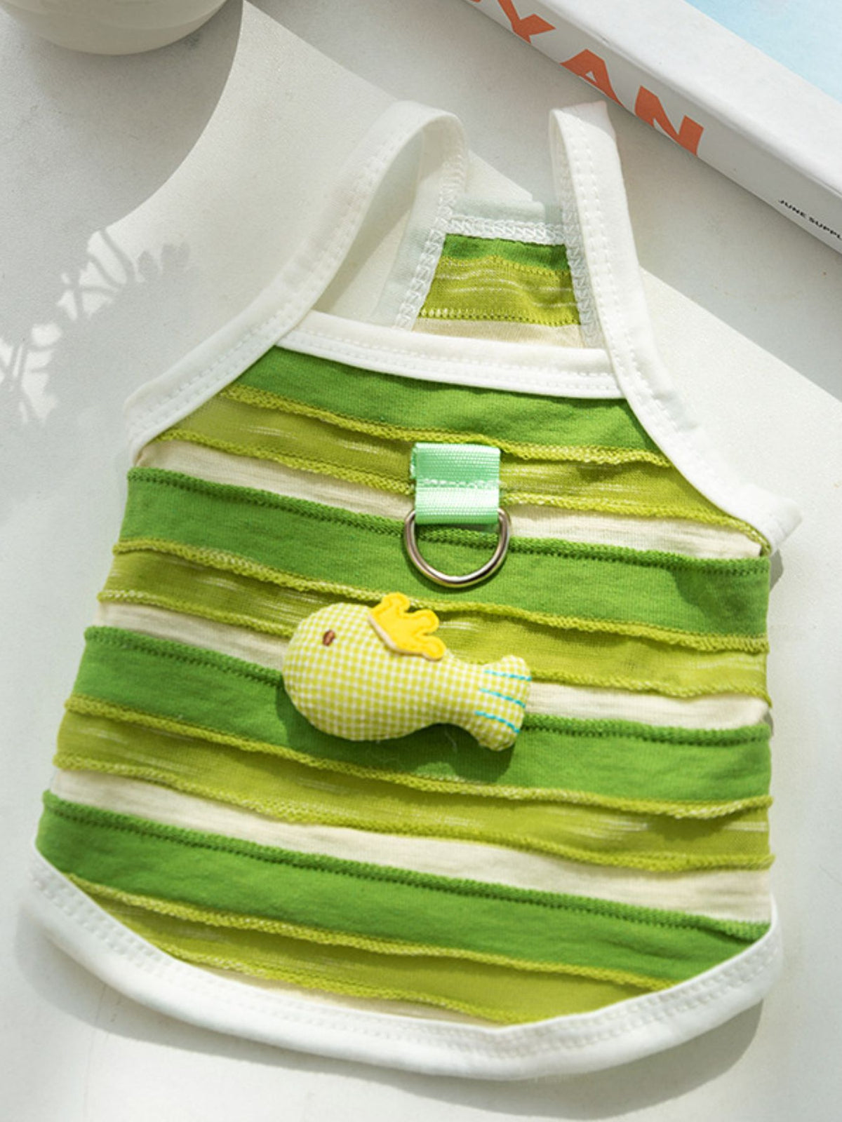Striped breathable pet top from Trendsi, lightweight fabric, perfect for small dogs or cats, with colorful horizontal stripes.