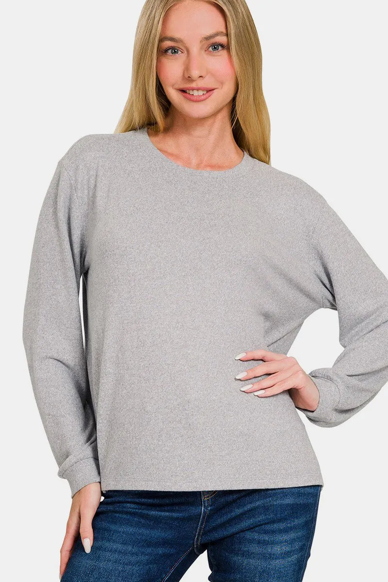 Black Zenana Hacci round neck long sleeve T-shirt from Trendsi, showcasing its soft fabric and classic fit.