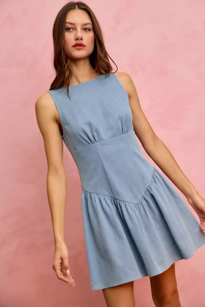 Sleeveless fit and flare denim mini dress by Trendsi, featuring a stylish silhouette and classic denim fabric.