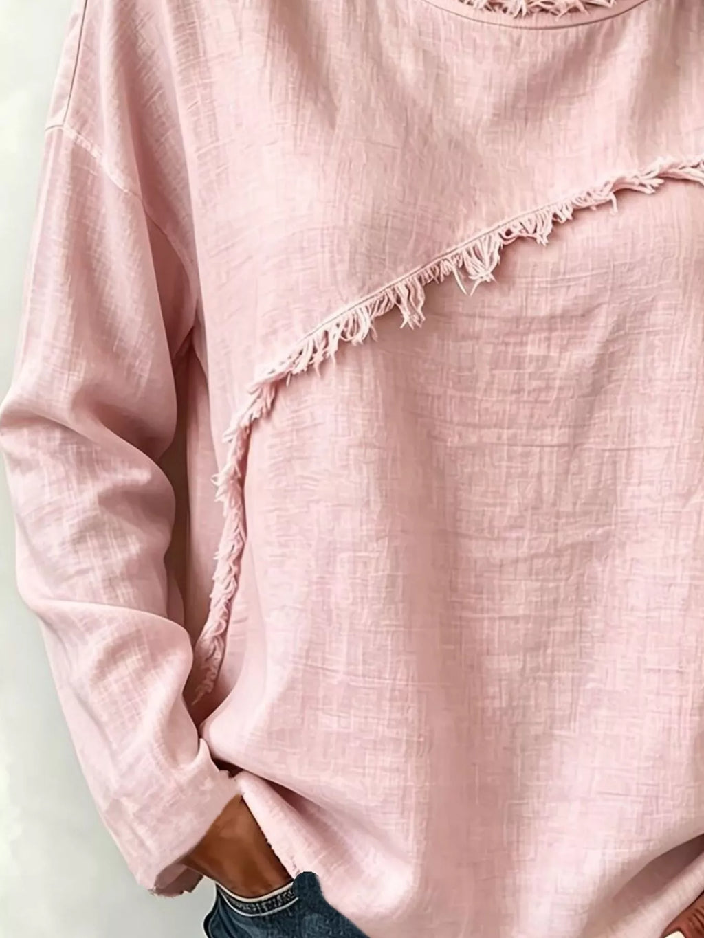 Frayed hem dropped shoulder blouse by Trendsi featuring lightweight fabric and relaxed fit on a model.