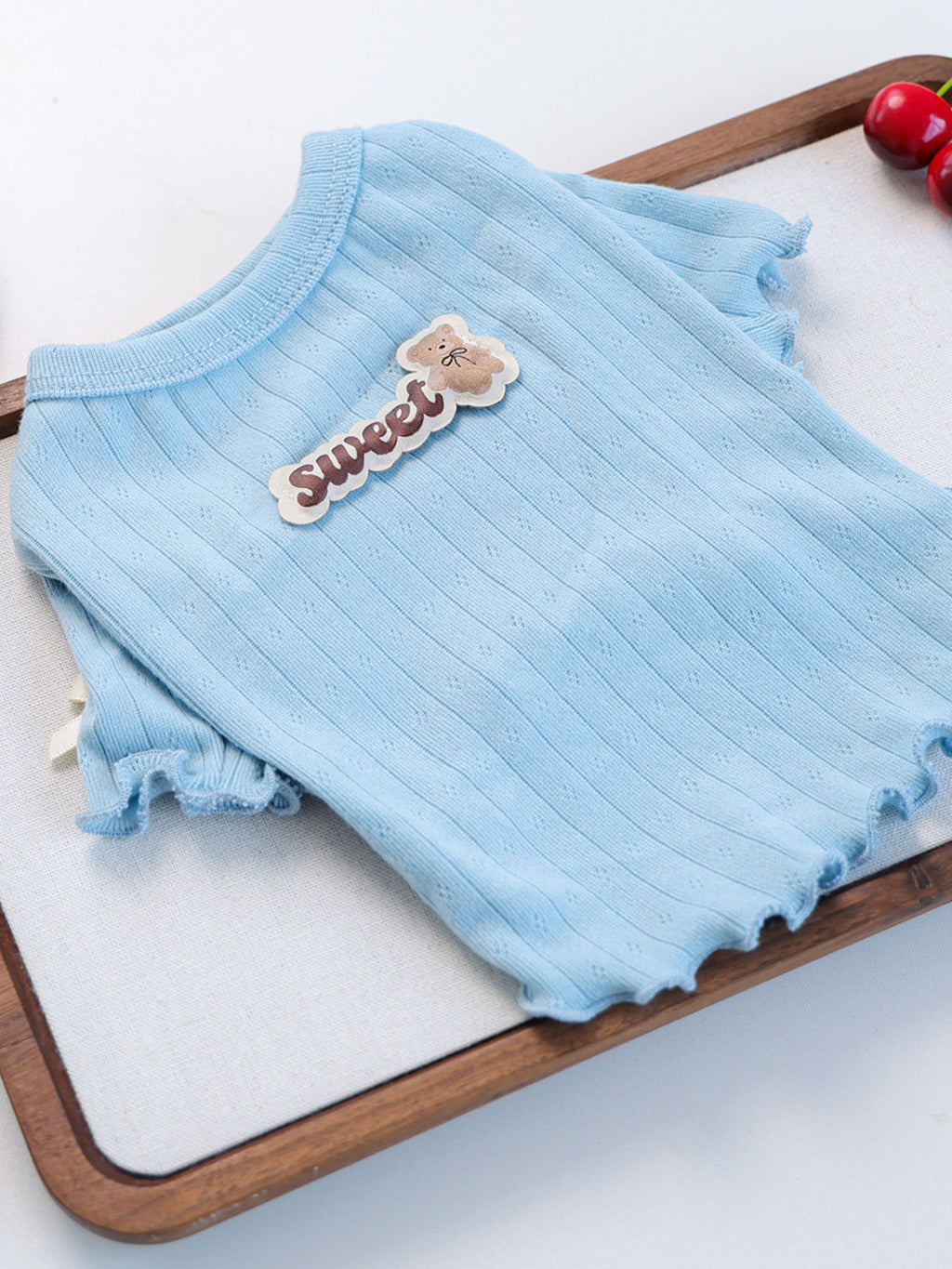 Sweet Bear Patch ribbed pet top from Trendsi, featuring a cute bear patch and ribbed fabric, designed for comfortable pet wear.