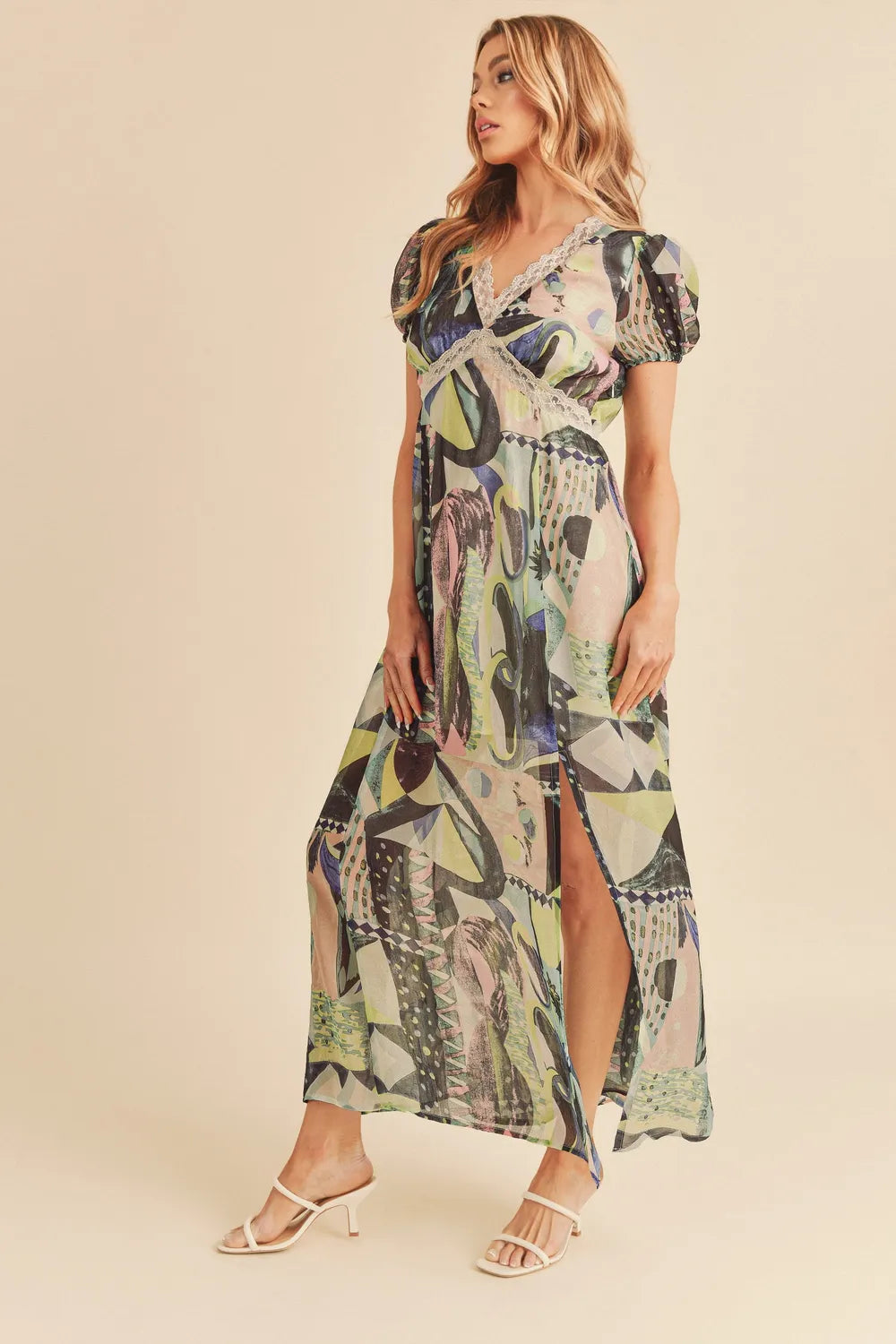Aemi + Co lace detail slit geometric print short sleeve maxi dress with a flowy silhouette and stylish design.