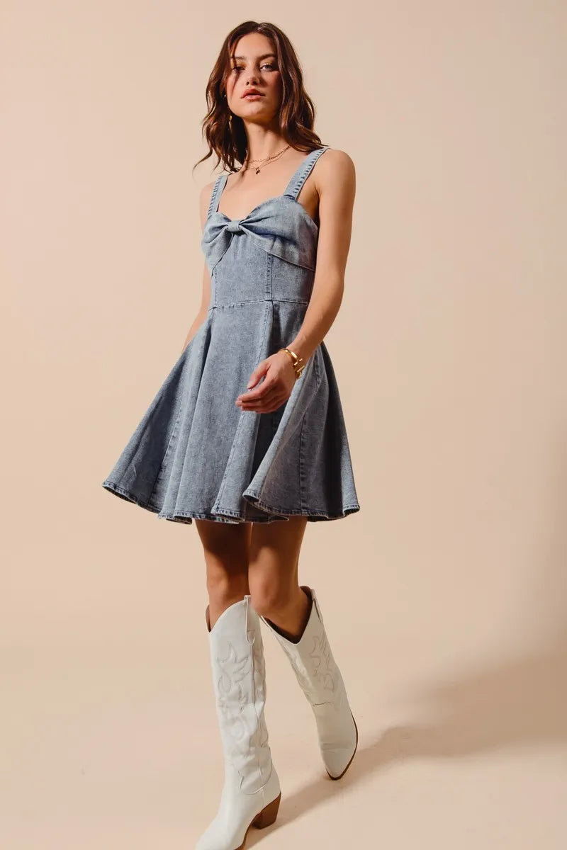 Mineral washed bow ribbon denim flare dress by Trendsi featuring a bow detail and flared silhouette