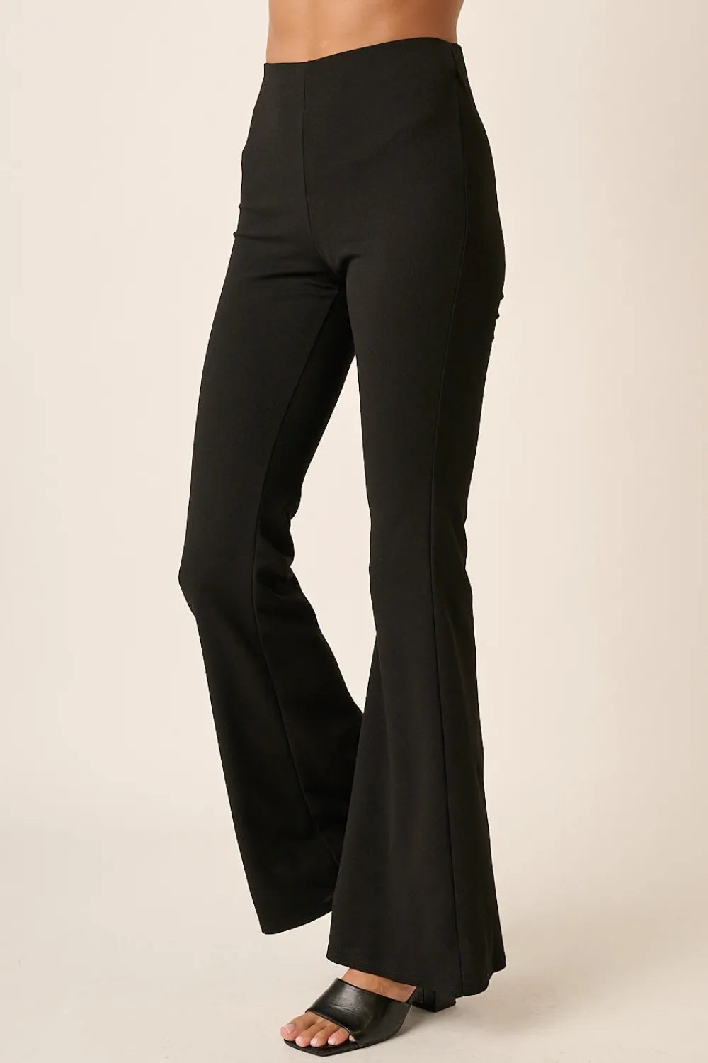 Cream crepe knit flare leg pants with elastic waist from Mittoshop by Trendsi, featuring a comfortable fit and stylish design.