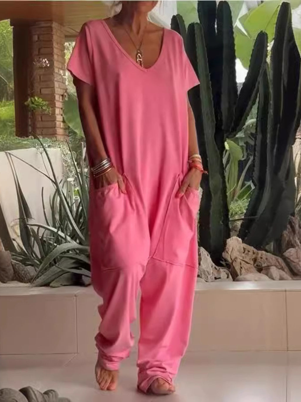Plus size loose fit V-neck short sleeve jumpsuit with wide leg pants, casual and comfortable from Trendsi.