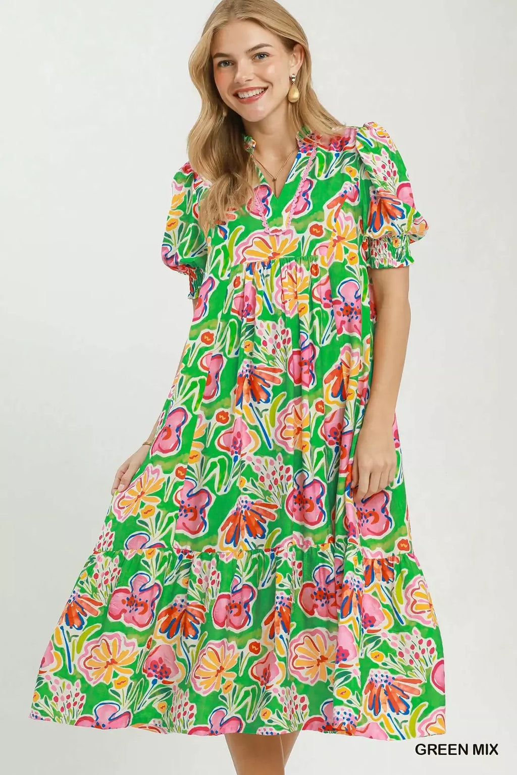 Umgee floral print puff sleeve tiered midi dress with feminine design and flowy fabric, shown on a model.