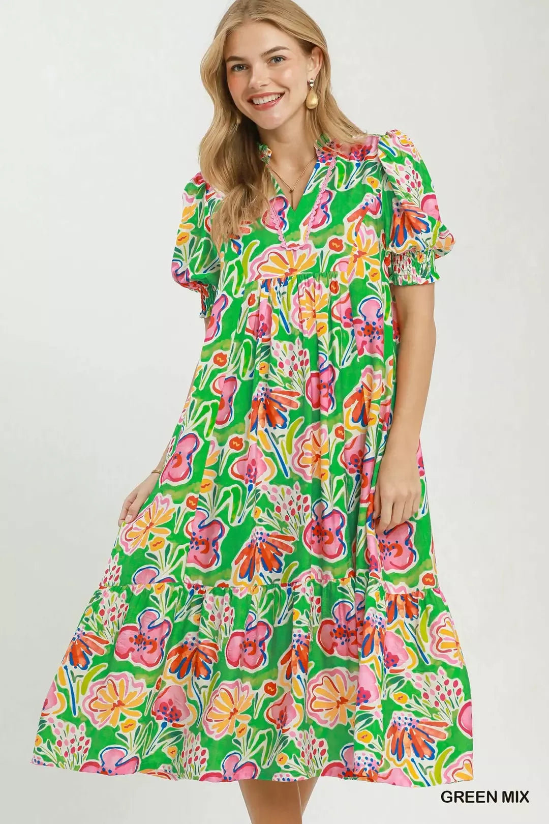 Umgee floral print puff sleeve tiered midi dress with feminine design and flowy fabric, shown on a model.