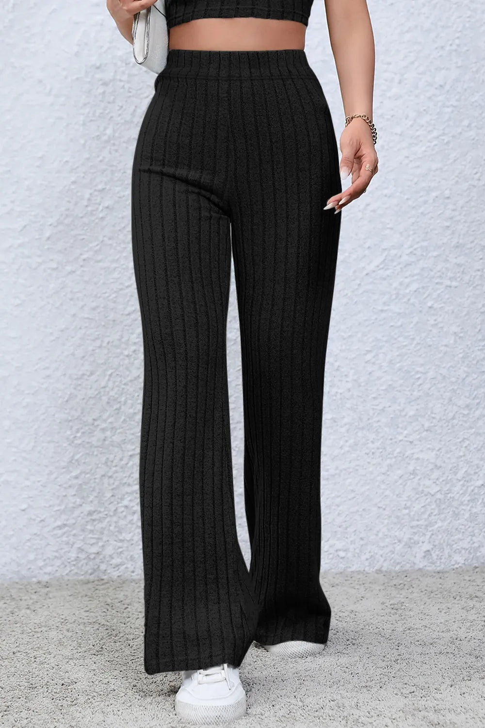 Ribbed high waist flare pants in full size, trendy basic Bae style from Trendsi, shown in black with a fitted waist and wide leg.