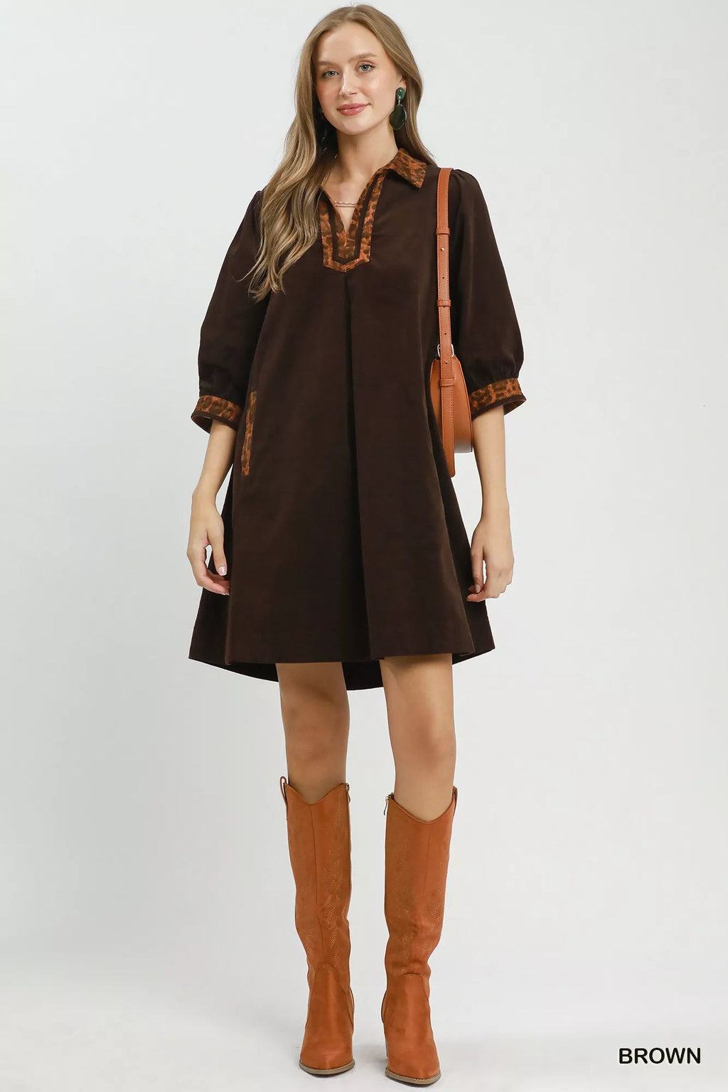 Umgee V-neck shift dress with contrast trim, featuring a relaxed fit and stylish detailing, perfect for casual wear.