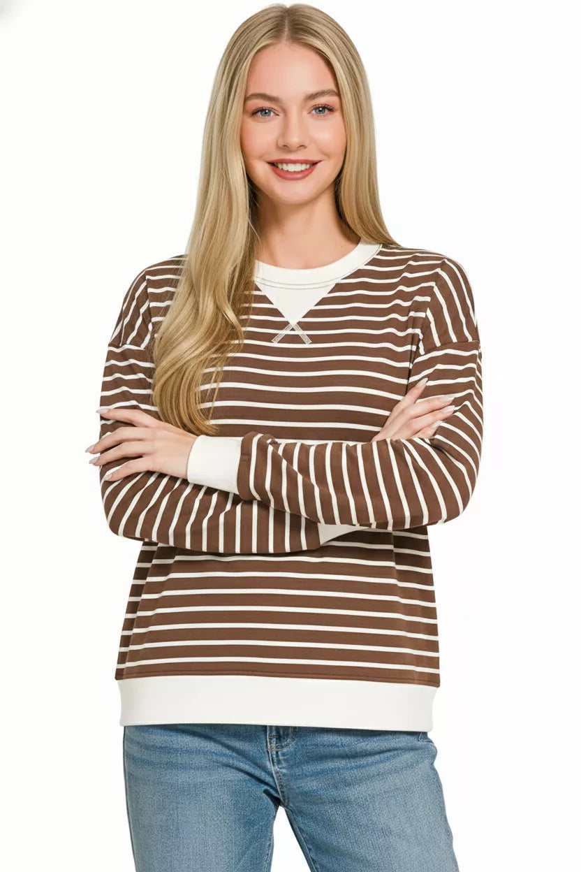 Zenana contrast striped round neck sweatshirt featuring long sleeves and a relaxed fit, in black and white vertical stripes.