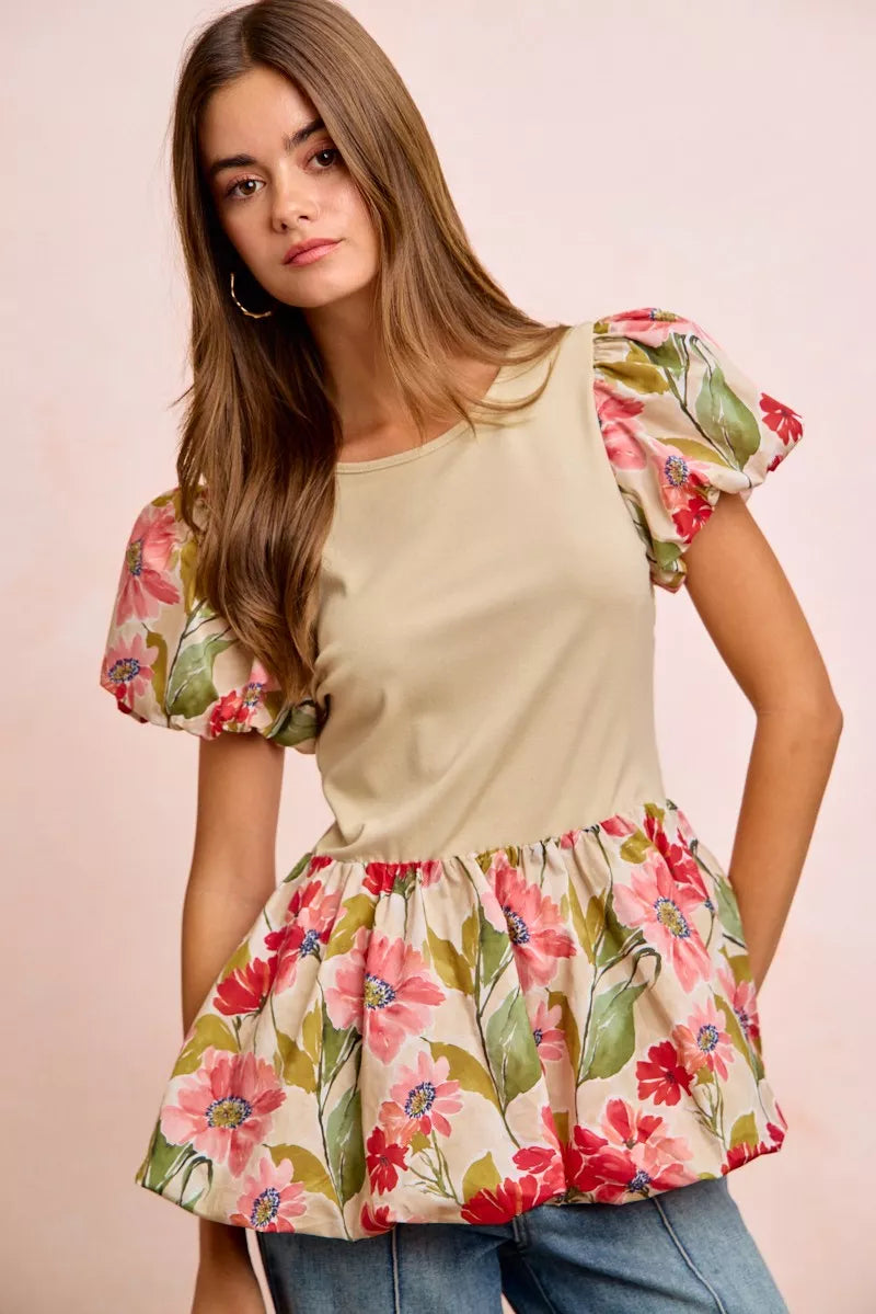 Floral printed bubble sleeves and peplum hem top from Trendsi, showcasing vibrant flower pattern and stylish design.