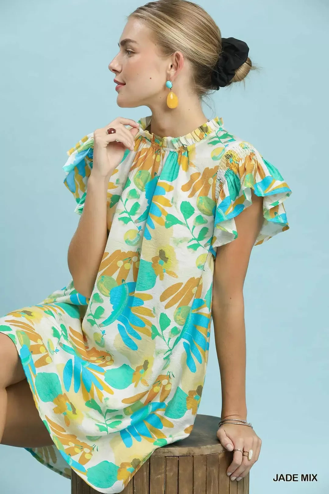 Umgee ruffled botanical print mini dress with flowing design and vibrant floral pattern, perfect for casual and summer wear.
