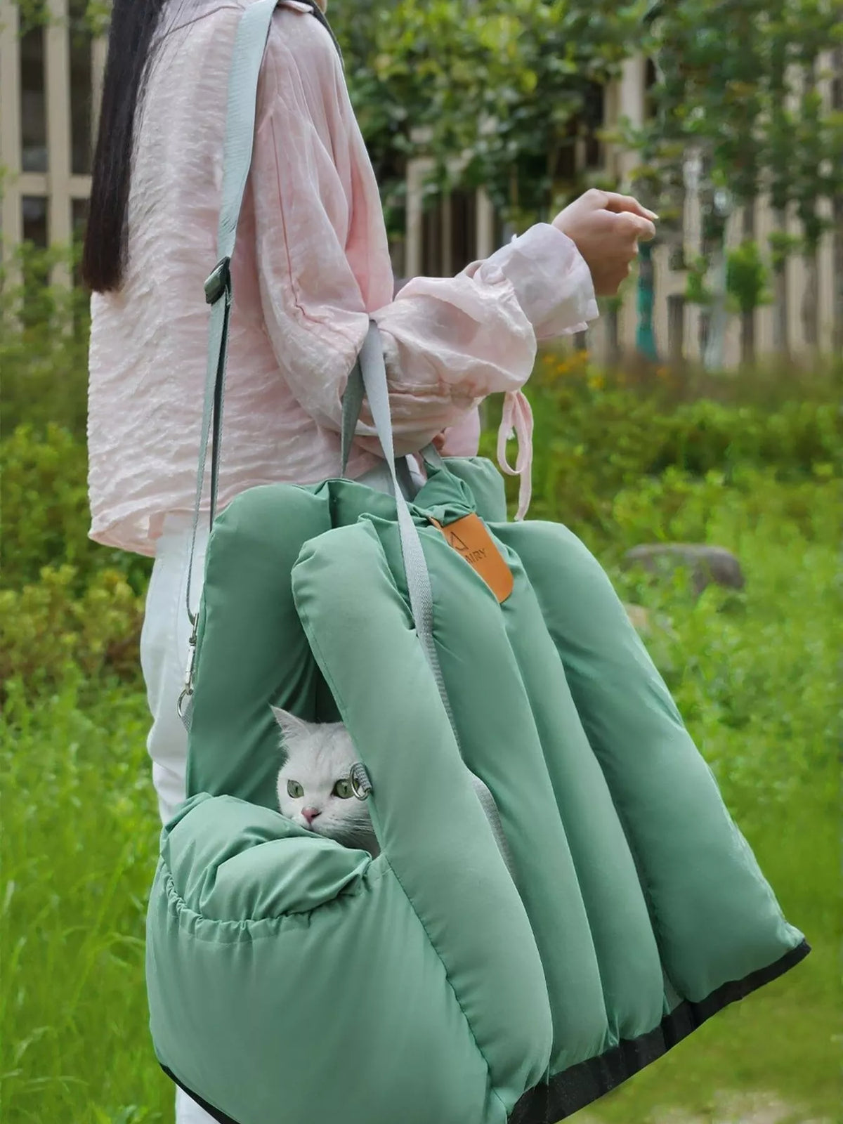 Comfortable and portable pet car nest by Trendsi, shown in a cozy, soft design suitable for travel comfort.