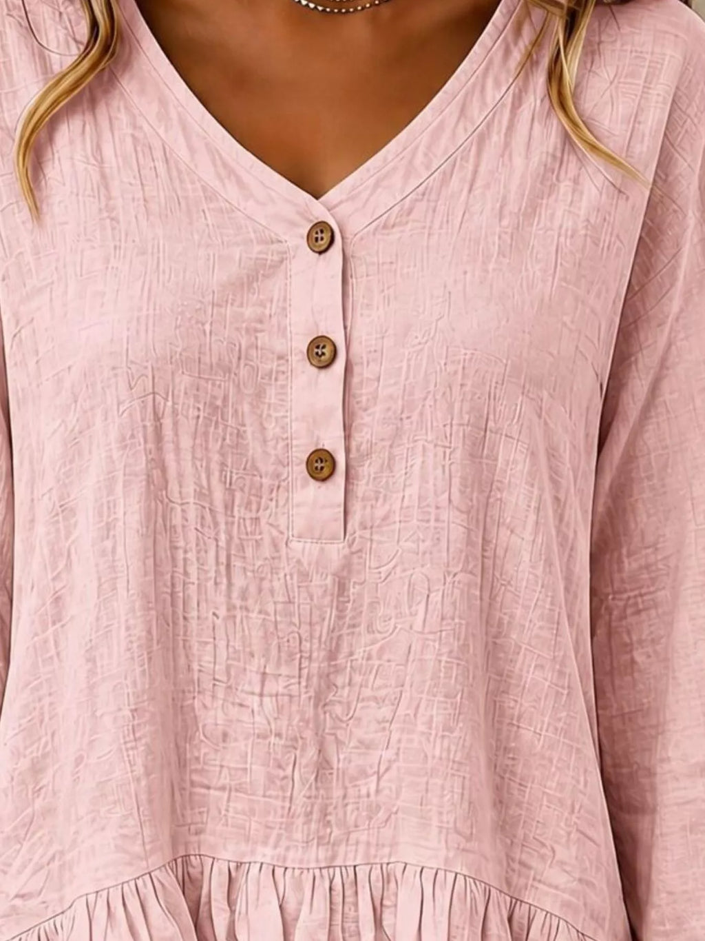 Long sleeve blouse with ruffled hem from Trendsi, featuring a feminine design and soft fabric, shown on a model.