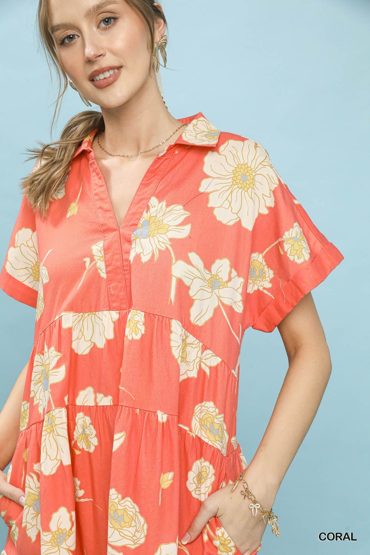 Umgee floral tiered babydoll dress with collar, featuring a feminine design and colorful floral pattern, perfect for casual wear.