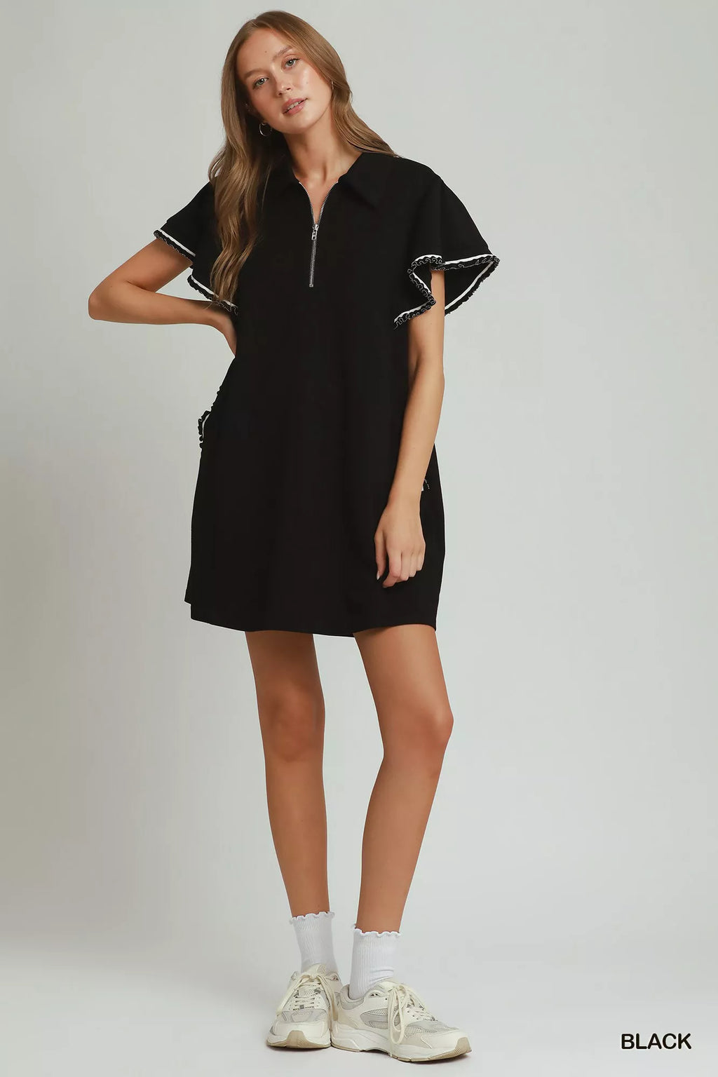 Trendsi Umgee mini dress with half zip, ruffle rib band, butterfly sleeves, and pockets, in a stylish, casual design.