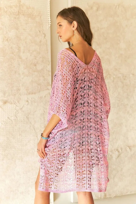 ADORA crochet cover-up tunic top by Trendsi, featuring intricate crochet pattern, lightweight fabric, and relaxed fit for beachwear.