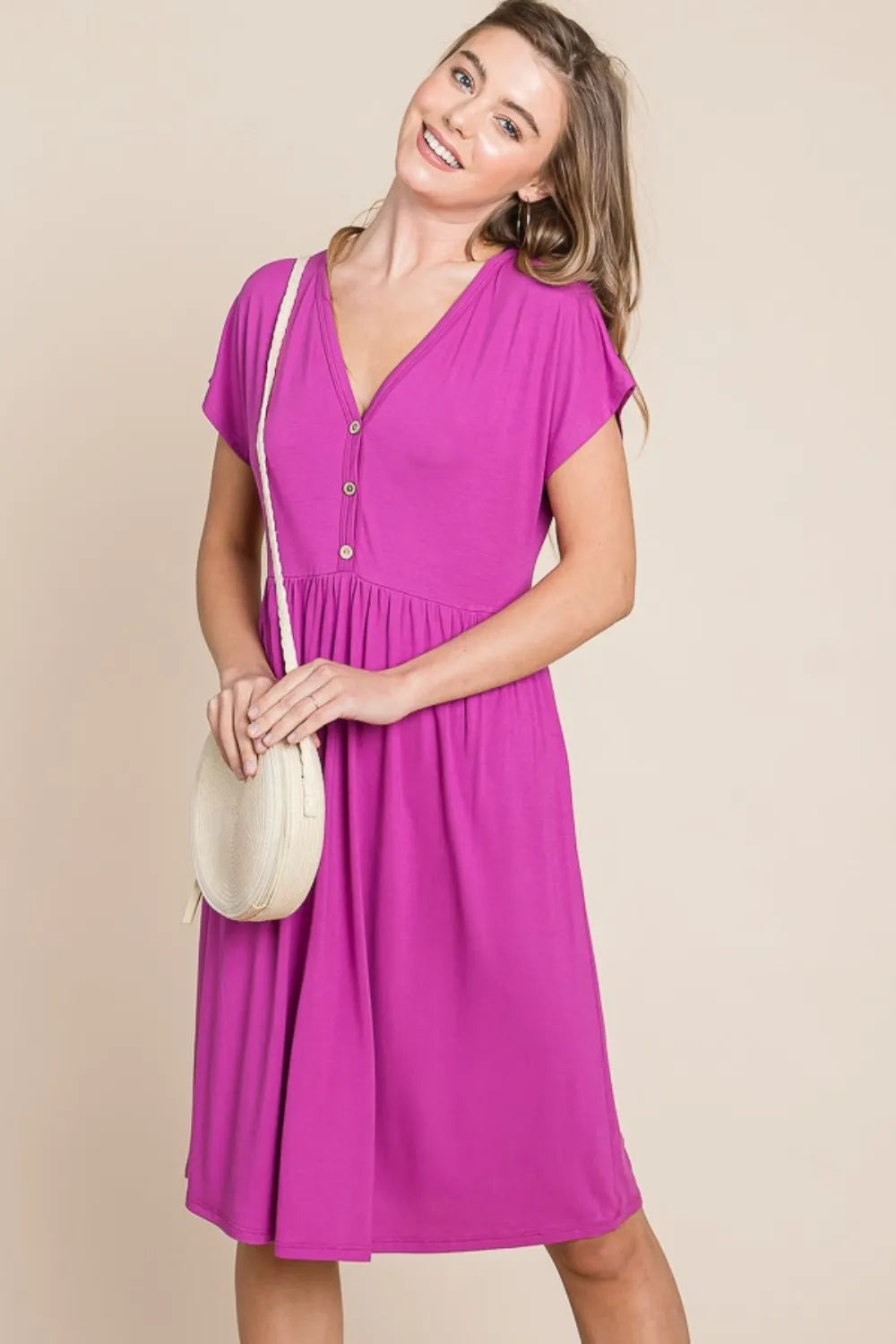 V-neck short sleeve dress by Trendsi, featuring a stylish and comfortable design ideal for casual and semi-formal wear.