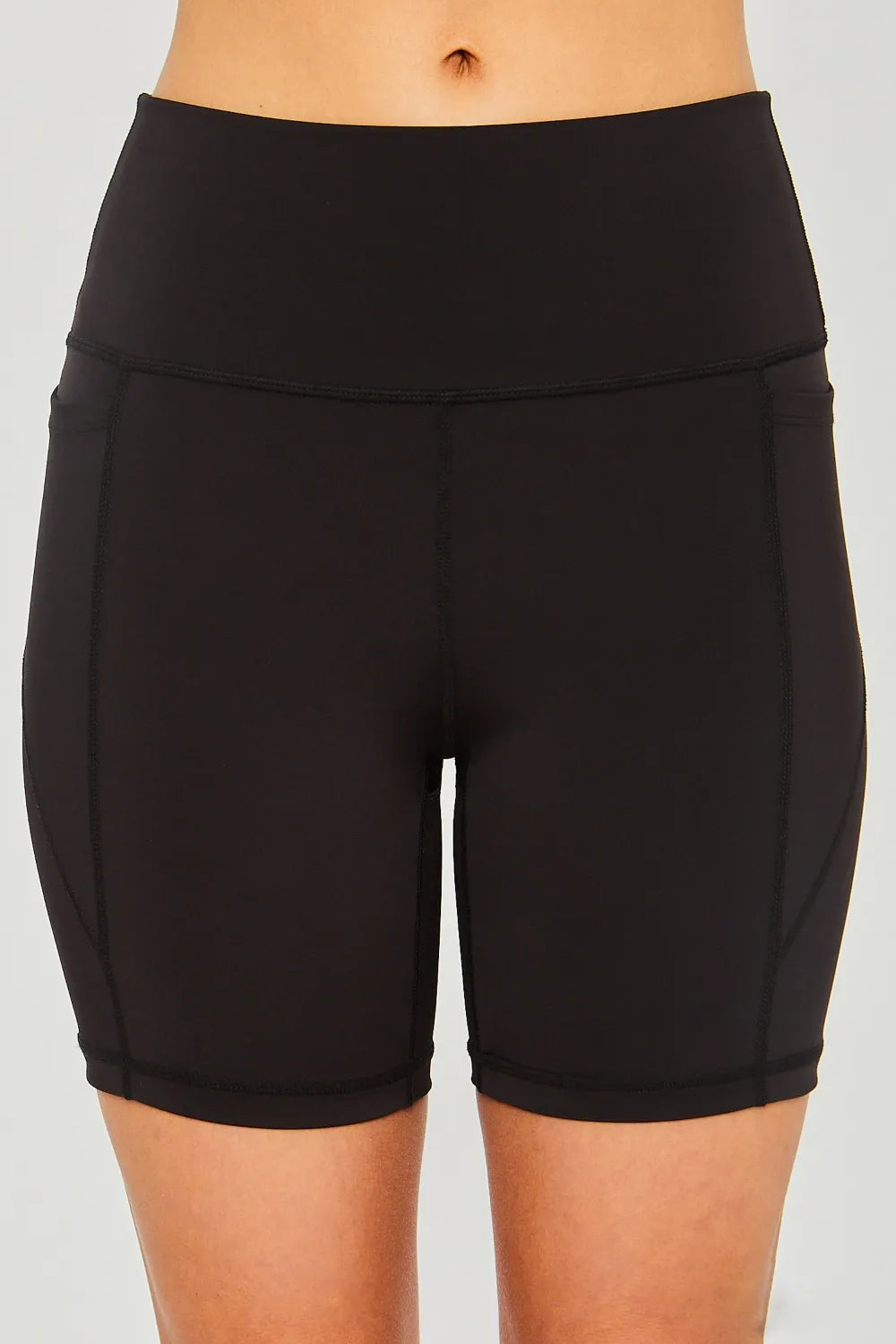 Love Tree high waist active shorts with seam detail, made by Trendsi, featuring a fitted design and comfortable stretch fabric.