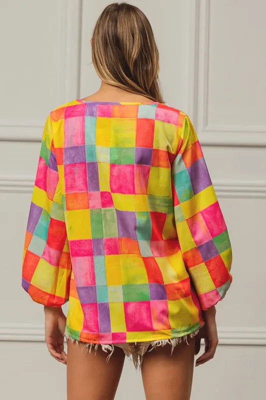 Colorful BiBi Multi Block Bubble Pop Balloon Top by Trendsi featuring vibrant bubble designs and playful, textured fabric.