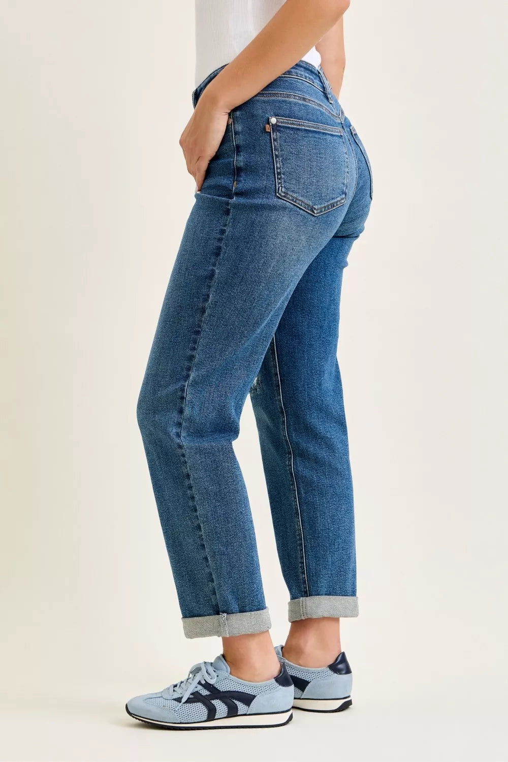 Light blue Judy Blue boyfriend jeans with mid-rise fit, embroidered repair patches, and distressed details.