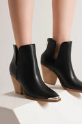 Beast Fashion pointed metal-tip toe block heel ankle boots by Trendsi, featuring sleek design and stylish ankle-height silhouette.