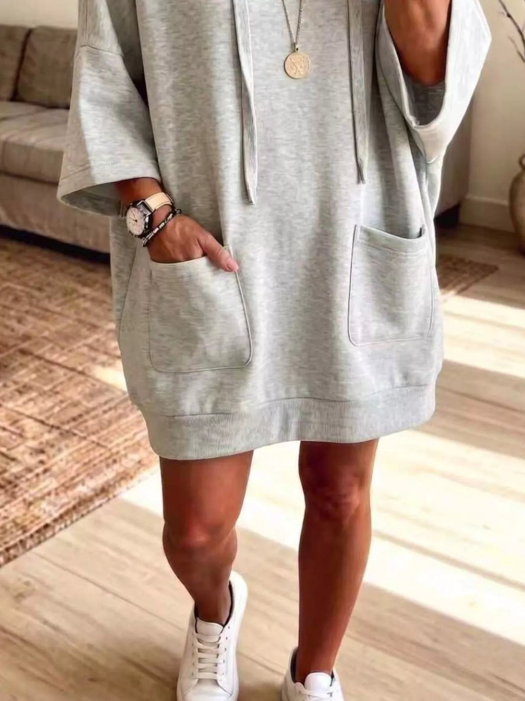 Plus size oversized hoodie with drawstring, front pockets, and a relaxed fit, featuring a trendy, comfortable design.