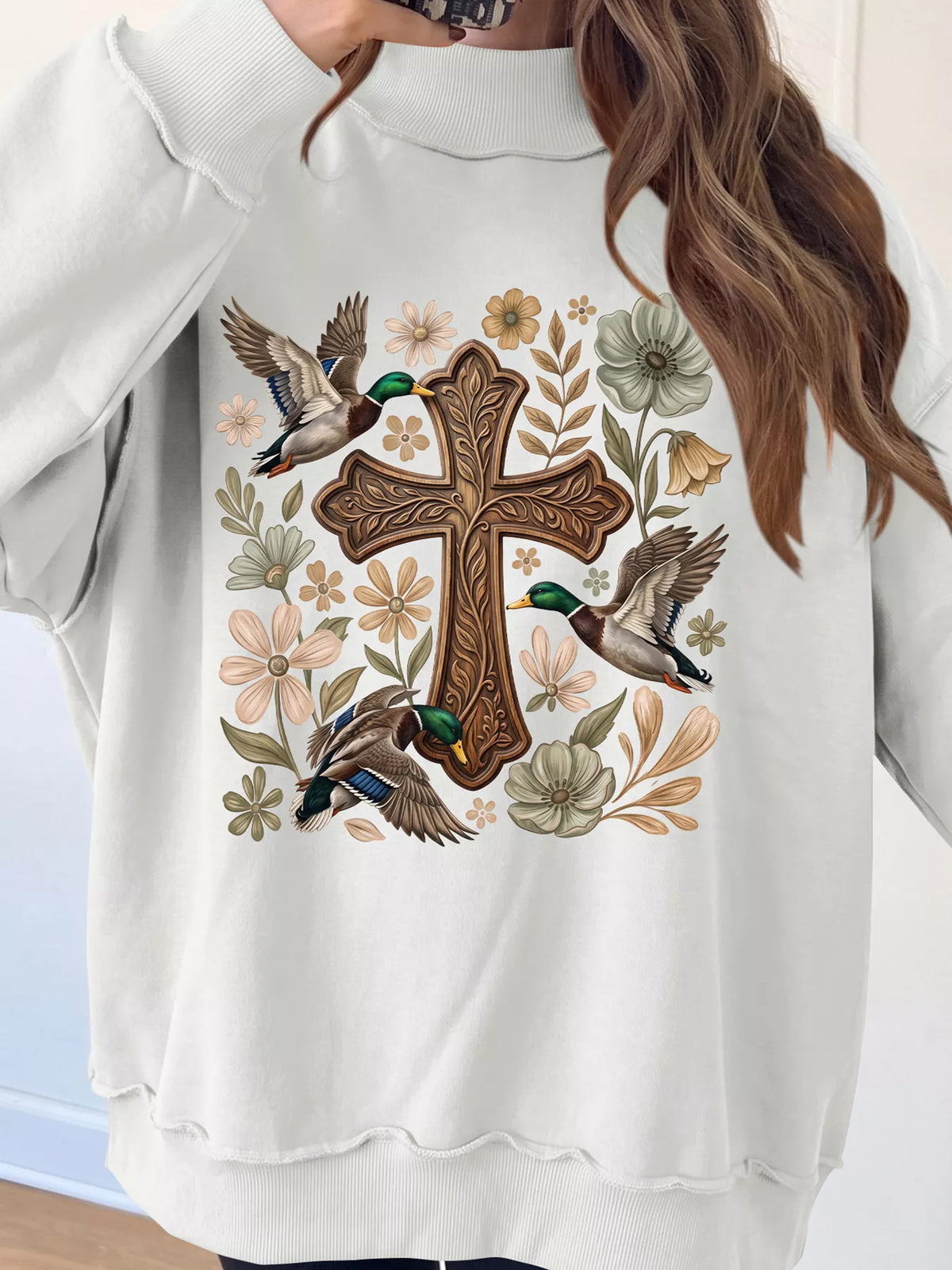White mock neck sweatshirt with floral cross print, view 3