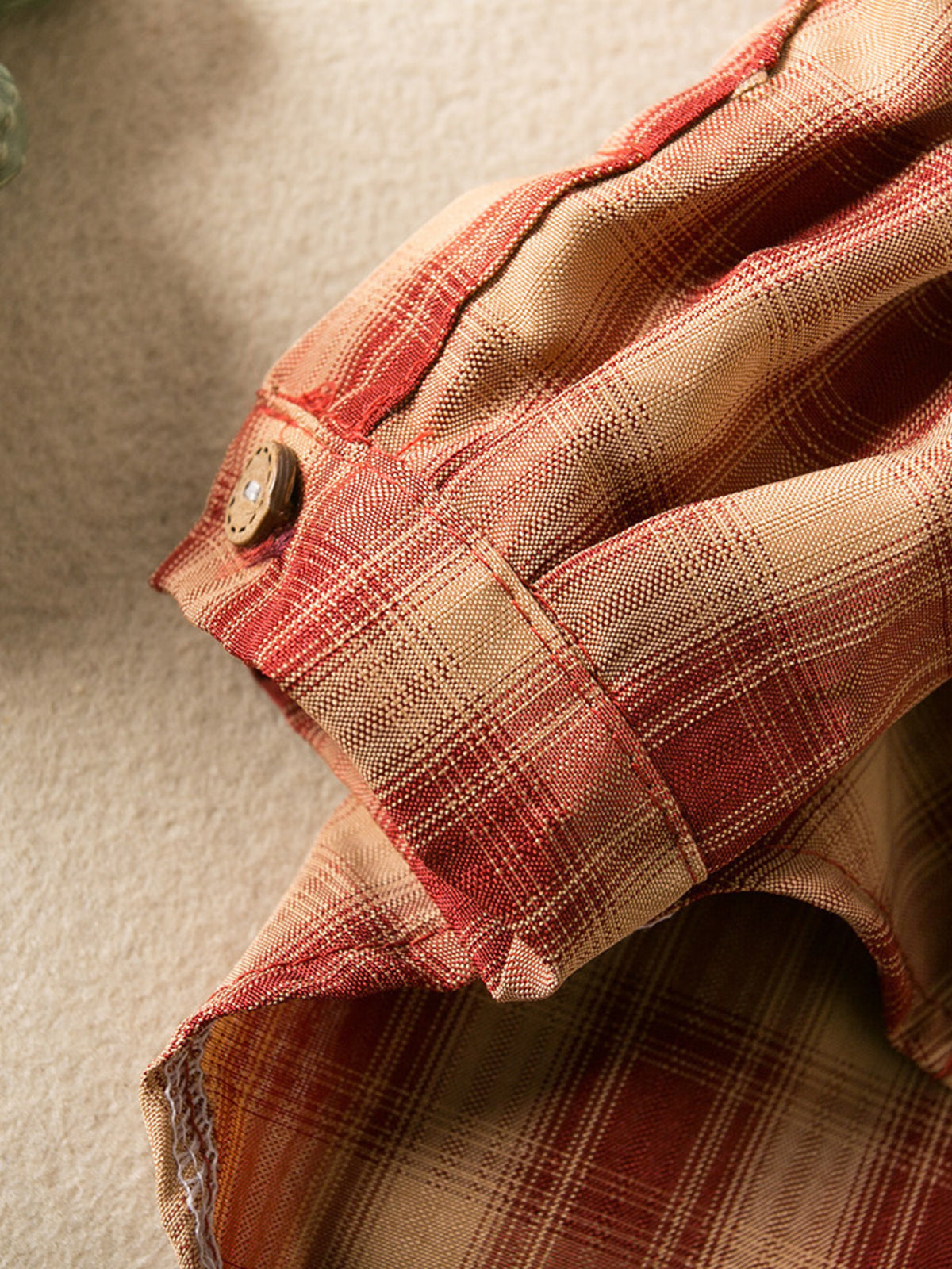 Plaid button-down pet shirt by Trendsi, featuring a stylish red and black checkered design for dogs or cats.