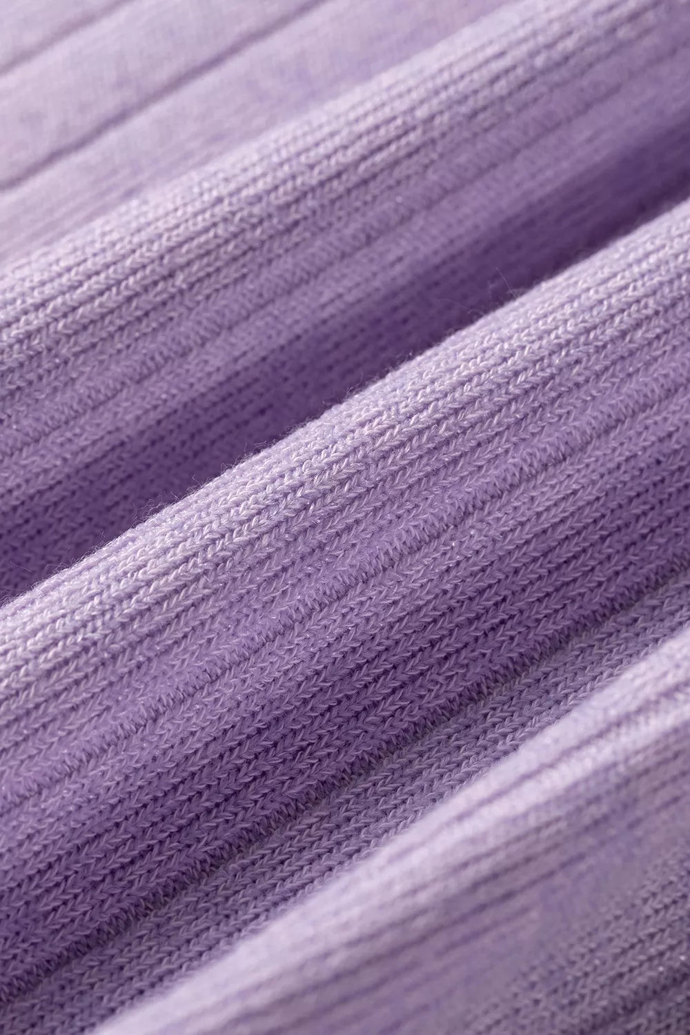 Solid color ribbed long sleeve casual top with round neckline, from Trendsi, featuring a fitted ribbed texture.