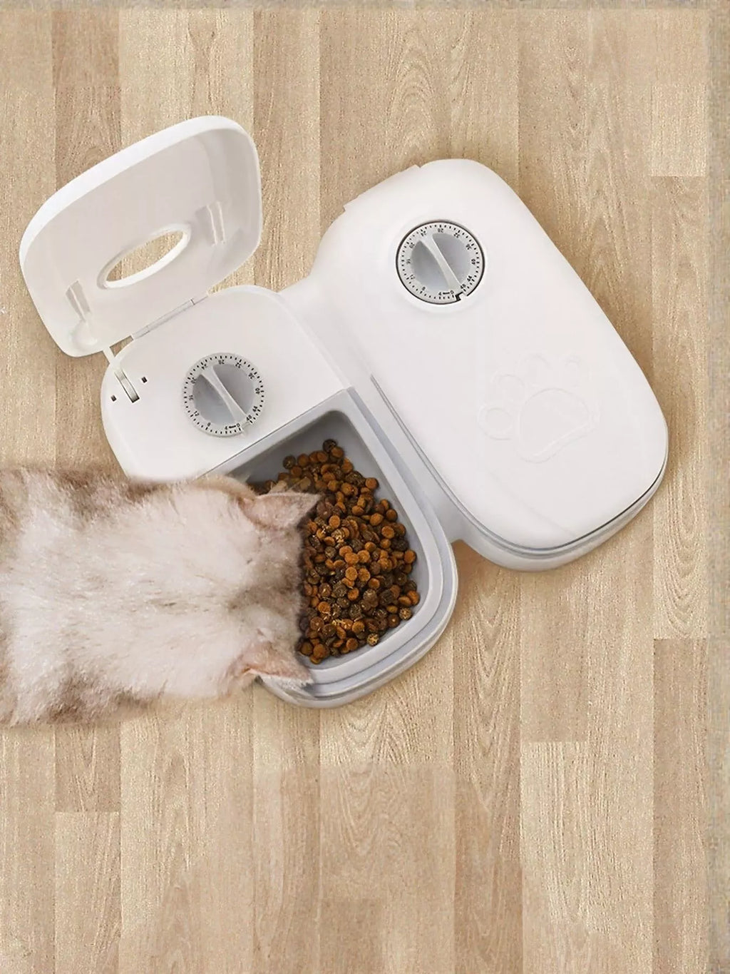 Automatic pet feeder with portion control by Trendsi, showing a sleek black device with food compartment and digital control panel.