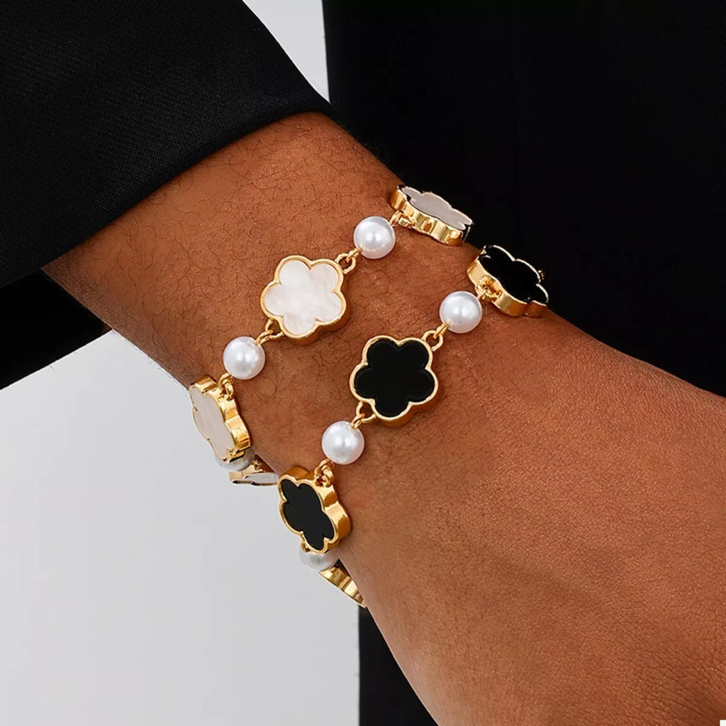 Gold-plated alloy flower bracelet featuring intricate floral design, showcasing elegant jewelry craftsmanship.