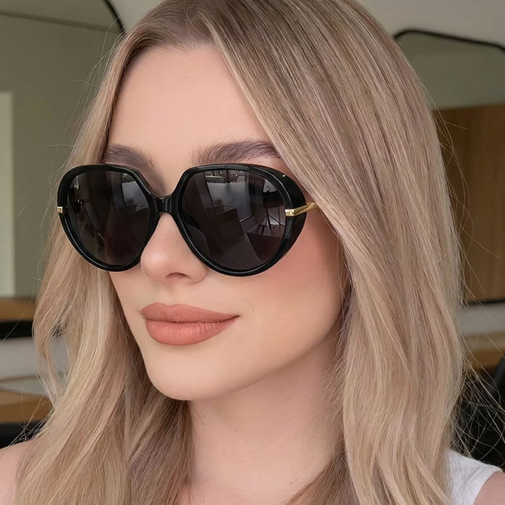 Oversized tinted lenses sunglasses with black frames, stylish and trendy, perfect for sun protection and fashion.