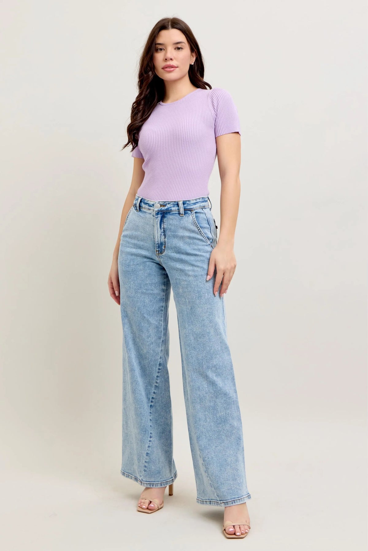 Plus size Judy Blue high waist wide leg jeans with skewed inseam, showcasing a flattering fit and stylish design.