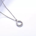 Sterling silver zircon pendant necklace with a sparkling gemstone, elegant jewelry piece on a delicate chain.