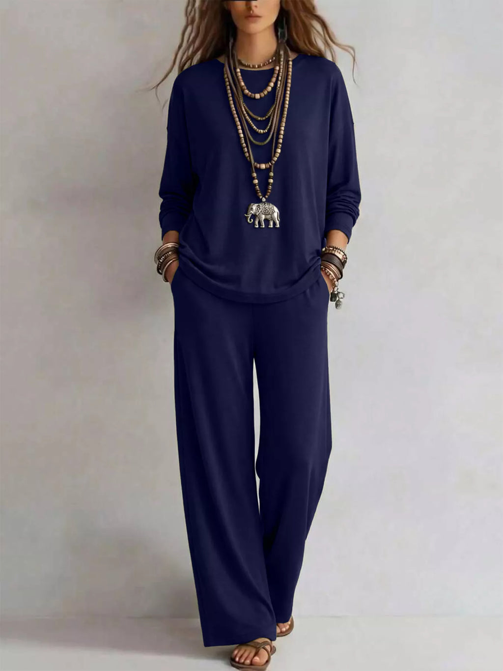 Trendsi round neck t-shirt and wide-leg pants set, featuring a casual stylish outfit with a fitted top and flowy pants.