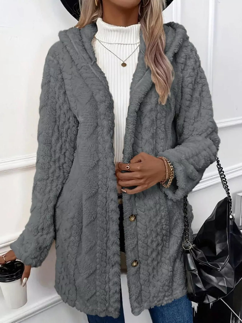 Full size cozy cable-knit faux fur hooded outerwear by Trendsi, featuring plush faux fur lining and a chunky cable-knit design