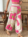 Floral print wide-leg pants from Trendsi featuring a relaxed fit, vibrant floral pattern, and flowy fabric.