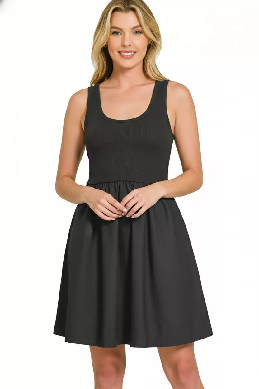 Trendsi Zenana knit and woven midi dress displayed on a hanger, featuring a mixed fabric design with a flattering silhouette.