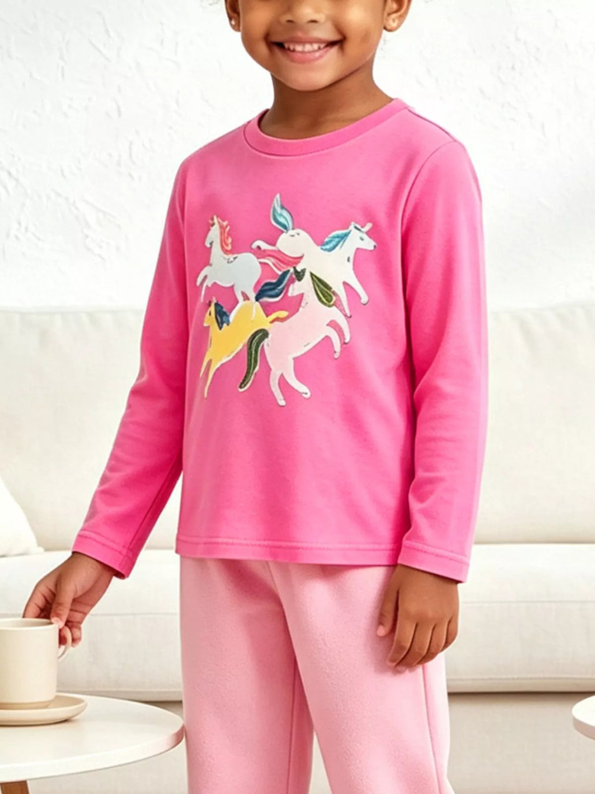 Children's unicorn graphic long-sleeve T-shirt by Trendsi, featuring colorful unicorn print on soft fabric.