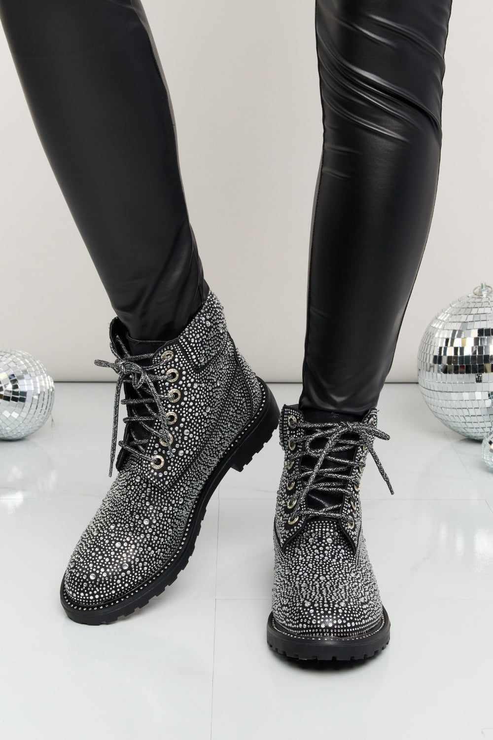Forever Link Rhinestone Lace-Up Combat Boots by Trendsi with rhinestone embellishments and sturdy lace-up design.
