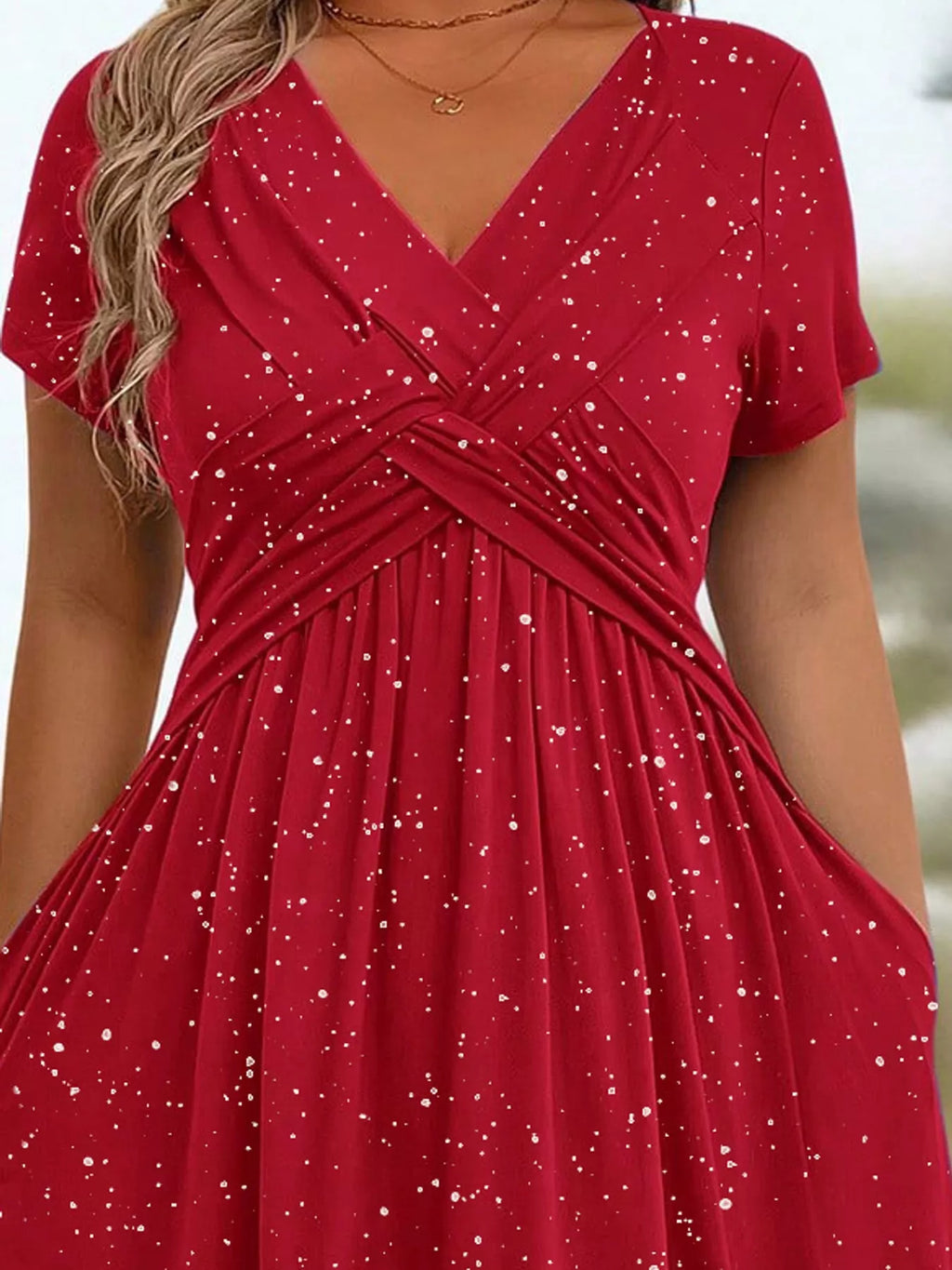 Plus size twisted front short sleeve midi dress with pockets by Trendsi, featuring a full-length design and stylish front twist detail.
