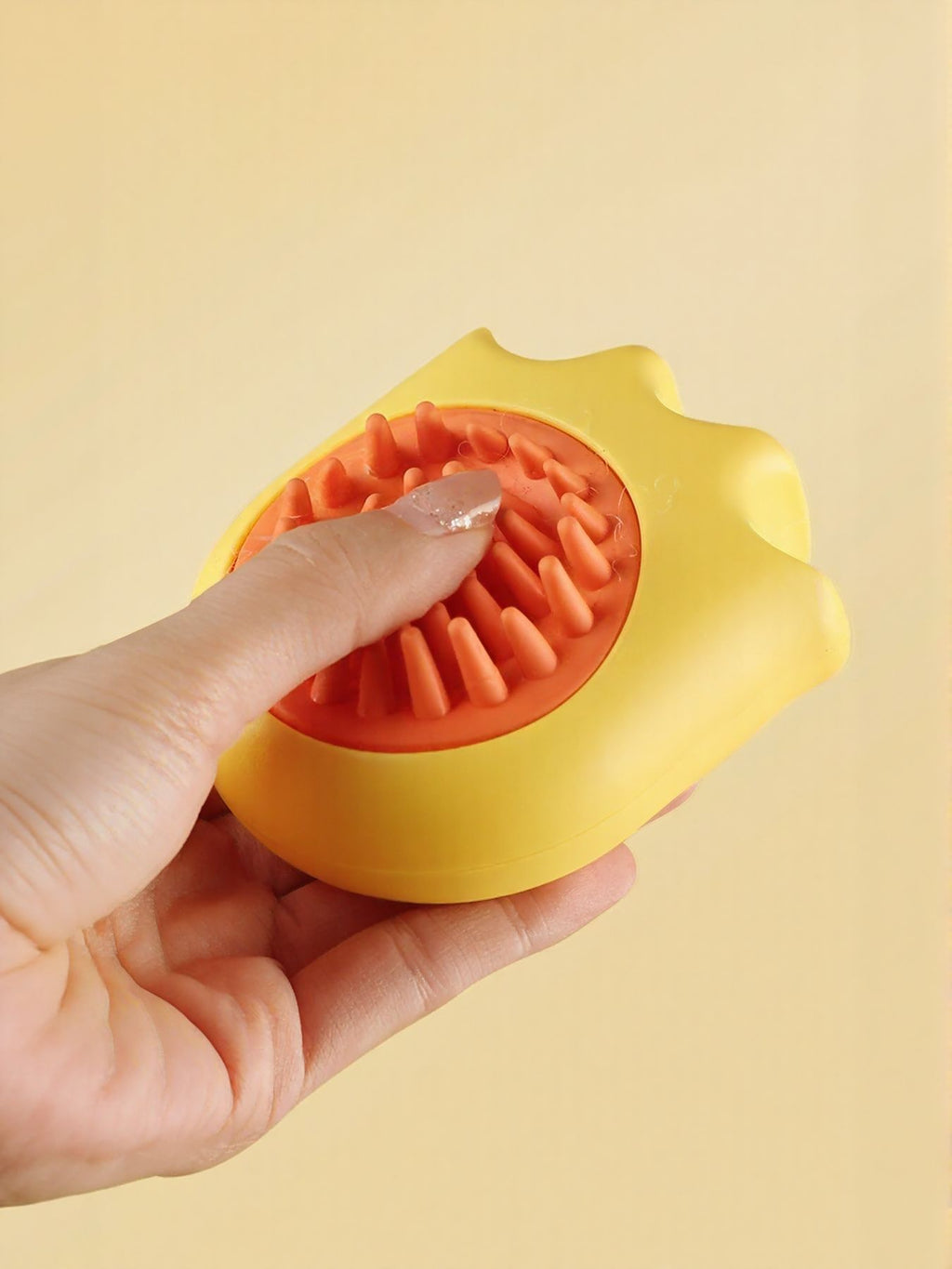 Soft pet shower brush by Trendsi with gentle bristles for bathing and grooming cats and dogs.